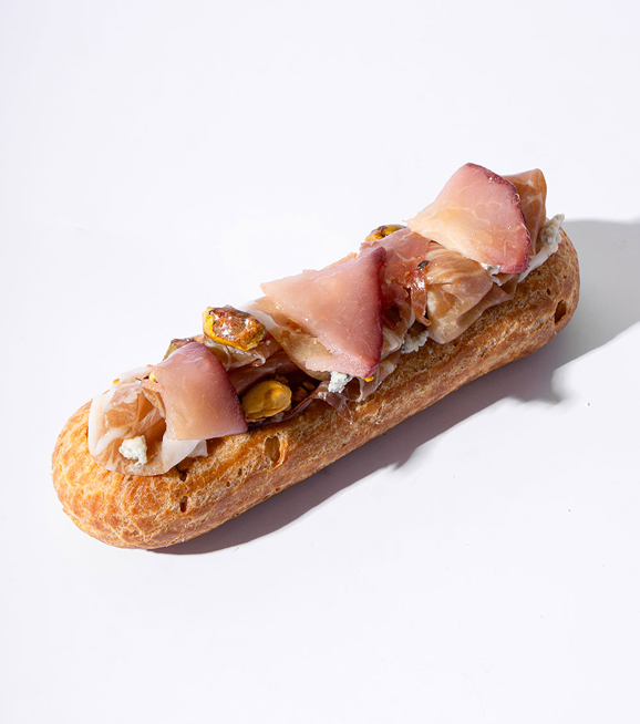 Savory prosciutto and pistachio éclair