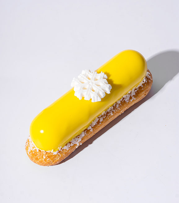 Lemon mirror-glaze éclair with snowflake decoration