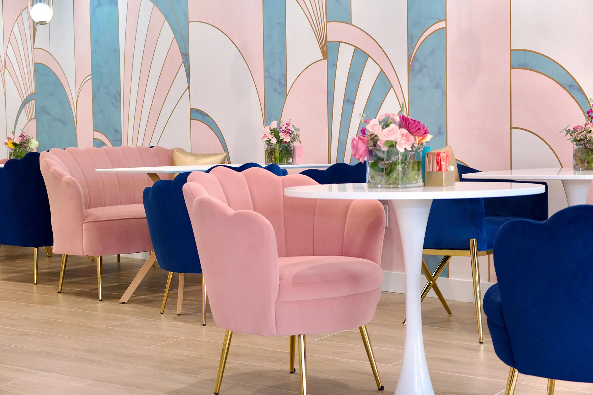 Éclair Affaire Weston interior — Art Deco café with pink and navy velvet armchairs